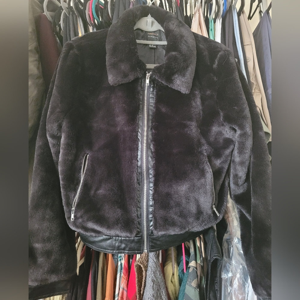 New black soft faux fur bomber jacket. zipper front & pockets. snaps on wrist.